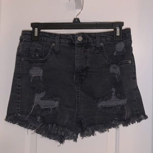 Black distressed jean shorts. Frayed edges